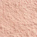 Billedet viser et makrobillede af SuperClear Proteinpulver med jordbær- og mangosmag fra NutriPur.
