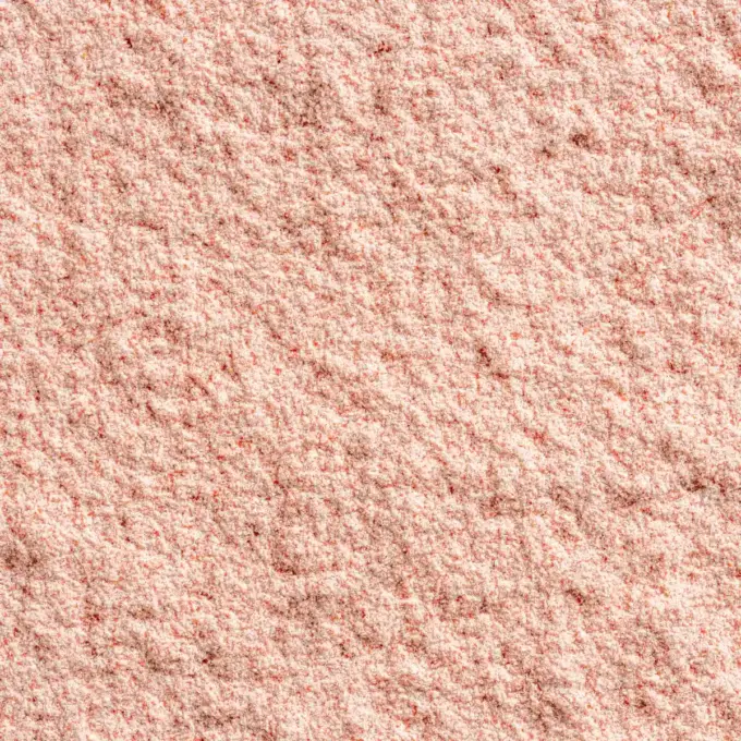 Billedet viser et makrobillede af SuperClear Proteinpulver med jordbær- og mangosmag fra NutriPur.
